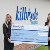 (L-R) Cala Homes’ Sarah Scott handing the funds over to Kilbryde Hospice’s Gordon McHugh and Claire Crawford.