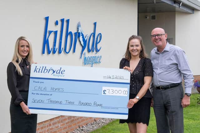 (L-R) Cala Homes’ Sarah Scott handing the funds over to Kilbryde Hospice’s Gordon McHugh and Claire Crawford.