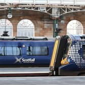 RMT conductors at Glasgow Central are among those being balloted for strikes if door control on electric trains being deployed on the Barrhead route from December 10 switches to drivers. (Photo by John Devlin/The Scotsman)