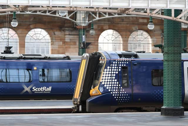 RMT conductors at Glasgow Central are among those being balloted for strikes if door control on electric trains being deployed on the Barrhead route from December 10 switches to drivers. (Photo by John Devlin/The Scotsman)