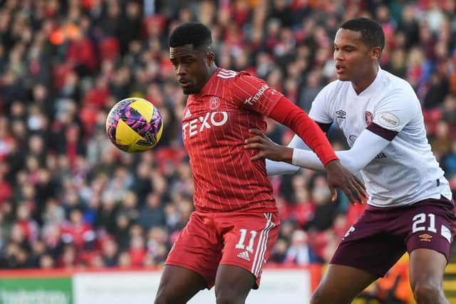 Aberdeen's Luis Lopes and Hearts' Toby Sibbick in action during the previous clash at Pittodrie in October. (Photo by Craig Foy / SNS Group)