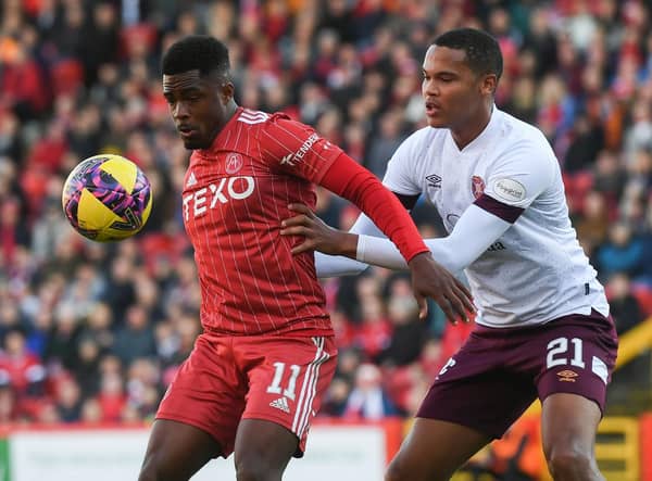 Aberdeen's Luis Lopes and Hearts' Toby Sibbick in action during the previous clash at Pittodrie in October. (Photo by Craig Foy / SNS Group)