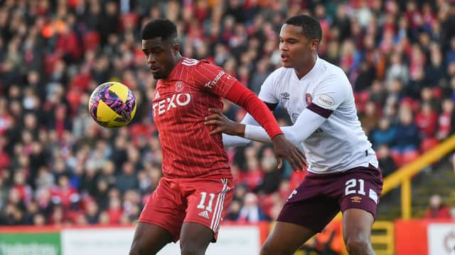 Aberdeen's Luis Lopes and Hearts' Toby Sibbick in action during the previous clash at Pittodrie in October. (Photo by Craig Foy / SNS Group)
