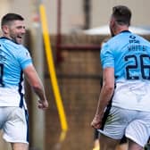 Iain Vigurs celebrates after firing Ross County level. Picture: SNS