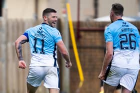 Iain Vigurs celebrates after firing Ross County level. Picture: SNS