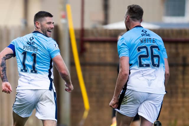 Iain Vigurs celebrates after firing Ross County level. Picture: SNS