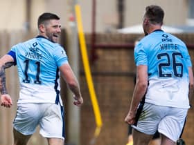 Iain Vigurs celebrates after firing Ross County level. Picture: SNS