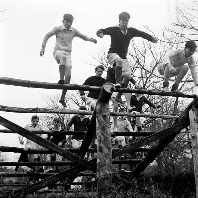 7th February 1956: Pupils at Gordonstoun School doing physical training on an obstacle course. Gordonstoun School, near Elgin, was founded in 1934 by German educationalist Kurt Hahn who believed in a holistic approach to teaching. Creative and personal development, considered of equal merit to traditional education, is encouraged among the pupils. (Photo by Chris Ware/Keystone Features/Getty Images)