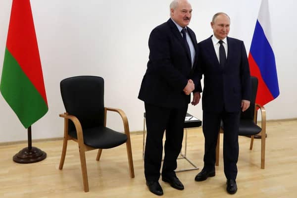 Russia's President Vladimir Putin (R) shakes hands with Belarus President Alexander Lukashenko in April.