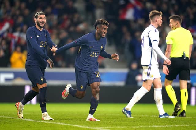 France's Kingsley Coman (centre) celebrates scoring their side's fourth goal against Scotland.