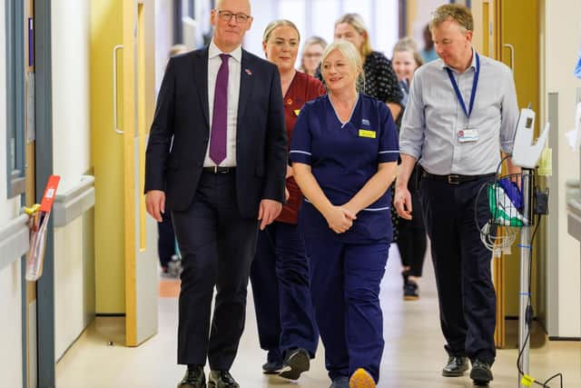 First Minister John Swinney with medical staff during a visit to Queen Elizabeth University Hospital; will Scots patients one day have a right to a second opinion? (Picture: Robert Perry/Getty Images)