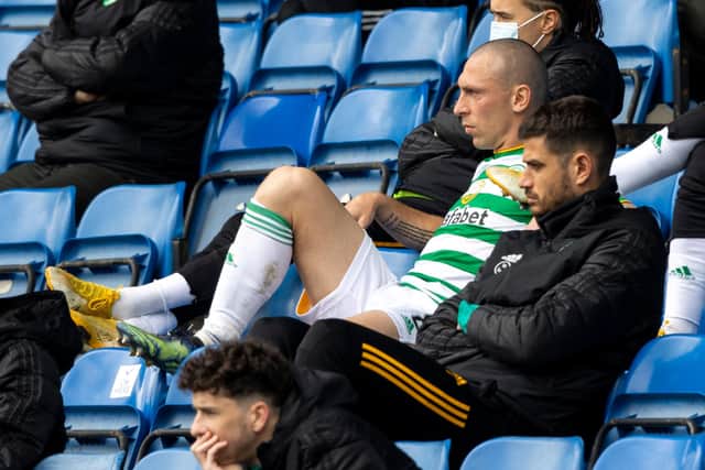 Celtic captain Scott Brown cuts a disconsolate figure as he sits in the stand after being substituted to bring a sorry end to his last experience of the club's jousts with Rangers. (Photo by Craig Williamson / SNS Group)
