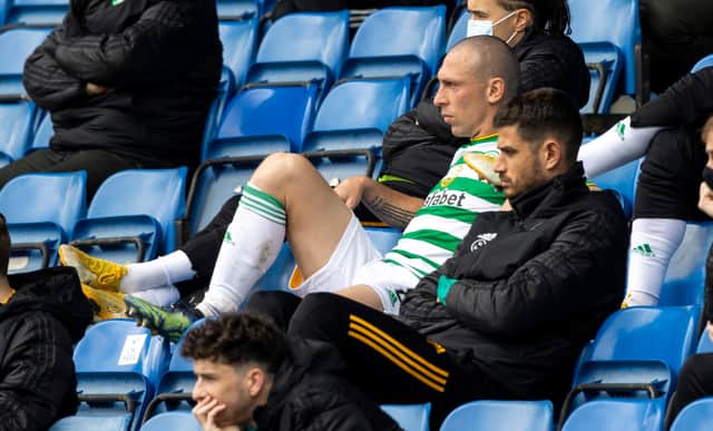 Celtic captain Scott Brown cuts a disconsolate figure as he sits in the stand after being substituted to bring a sorry end to his last experience of the club's jousts with Rangers. (Photo by Craig Williamson / SNS Group)