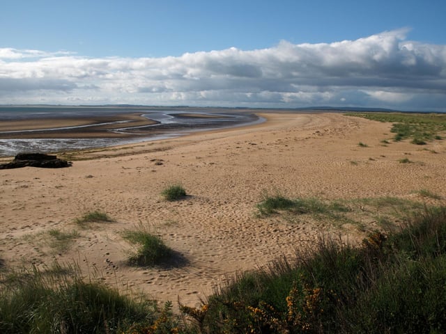 Another stretch of fine Highland sand, Dornoch's Blue Flag beach has shallow waters perfect for a paddle. There's plenty of car parking nearby and you might be lucky enough to see seals playing in the firth.