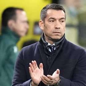 Rangers manager Giovanni van Bronckhorst applauds his players during the win over Dortmund.