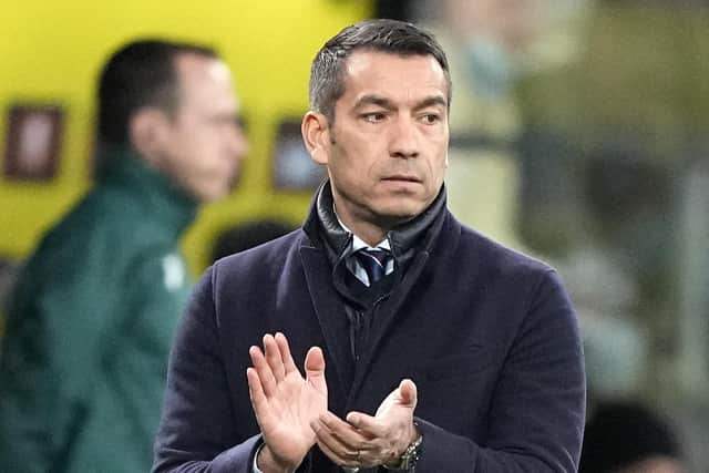Rangers manager Giovanni van Bronckhorst applauds his players during the win over Dortmund.