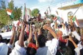 People carry on their shoulders Othman Mohamed, a senior general loyal to army chief Abdel Fattah al-Burhan, in the Red Sea city of Port Sudan, last week. British diplomats and their families have been evacuated from the country.