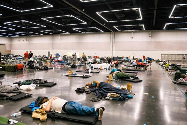 People rest at a cooling station set up in the Oregon Convention Center in Portland (Picture: Kathryn Elsesser/AFP via Getty Images)