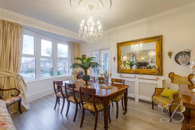 A second shot of the lovely dining room, with its laminate flooring, decorative coving and bay window overlooking the front of the £500,000-plus property.