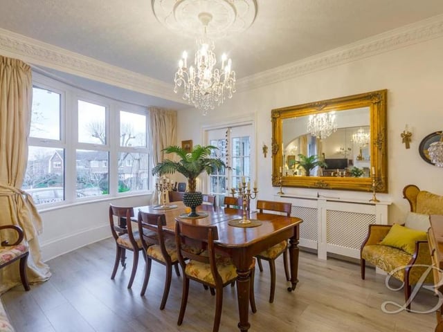 A second shot of the lovely dining room, with its laminate flooring, decorative coving and bay window overlooking the front of the £500,000-plus property.
