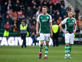 Hibs duo James Jeggo, right, and Will Fish show their dejection at full time against Motherwell.