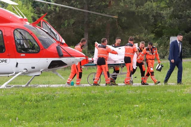 Slovak Prime Minister Robert Fico is transported from a helicopter by medics and his security detail to the hospital in Banska Bystrica, where he is being treated. Picture: AFP via Getty Images