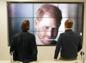 Office workers watching the Duke and Duchess of Sussex's controversial documentary being aired on Netflix.