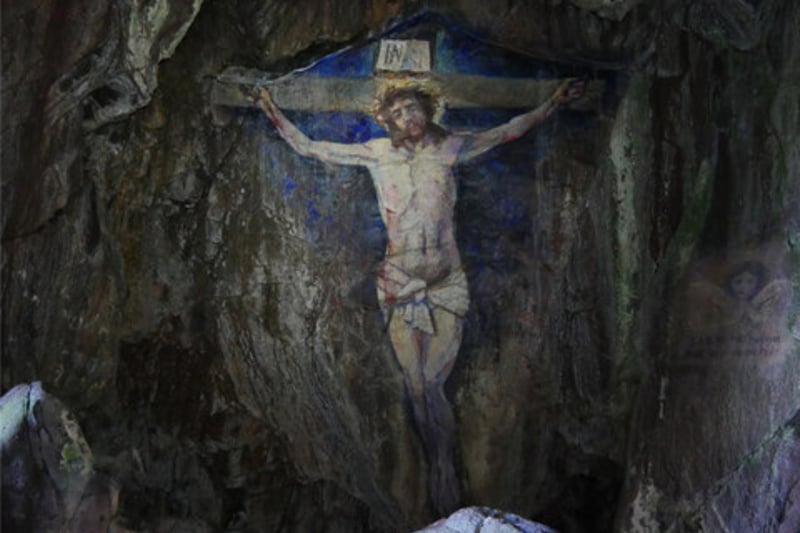 Crucifixion Cave sits on Davaar Island at the mouth of Campbeltown Loch off the east coast of Kintyre in Argyll and Bute. The cave is famous for a stunning life-sized painting of the Crucifixion decorating its interior. It was painted by a local art teacher, Archibald MacKinnon, in 1887 who did so after a dream prompted him to. The painting has been maintained other the years but was once defaced by an image of Che Guevara, a former minister of Cuba who - although widely praised - also helped create the first Cuban concentration camp.