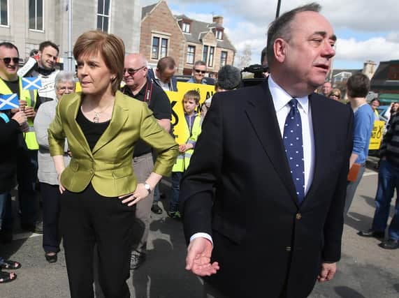 Nicola Sturgeon with Alex Salmond whilst on the general election campaign trail in 2014. Picture: Andrew Milligan/PA Wire