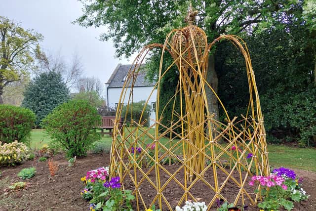 A sculpture of a crown made out of willow - a favourite of Charles's according to locals - in a Ballater flowerbed (pic: Katharine Hay)