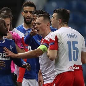 Glen Kamara of Rangers clashes with Ondrej Kudela of Slavia Praha during the UEFA Europa League Round of 16 Second Leg match between Rangers and Slavia Praha at Ibrox Stadium on March 18, 2021 in Glasgow, Scotland. (Photo by Ian MacNicol/Getty Images)