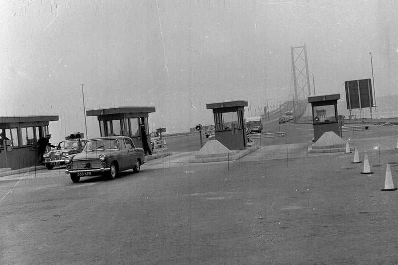 Forth Road Bridge traffic - a car passes the toll booth in 1964.