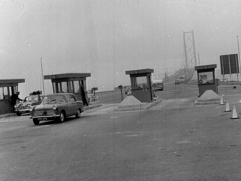 Forth Road Bridge traffic - a car passes the toll booth in 1964.