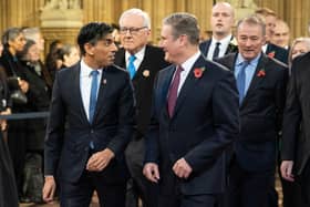 Rishi Sunak walks with Labour Party leader Sir Keir Starmer through the Central Lobby at the Palace of Westminster ahead of the State Opening of Parliament in the House of Lords.