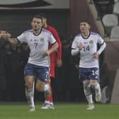 Scotland's John McGinn, centre, celebrates with teammates after scoring in the 2-1 defeat in Turkey. (AP Photo)