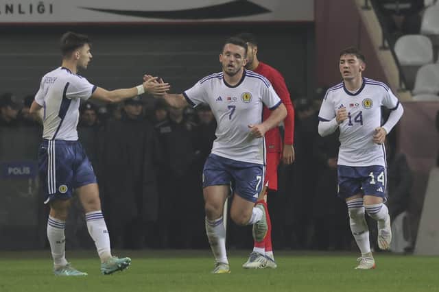 Scotland's John McGinn, centre, celebrates with teammates after scoring in the 2-1 defeat in Turkey. (AP Photo)