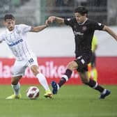 Donis Avdijaj battles Peter Haring during Zurich's win over Hearts. Pic: Ennio Leanza/Keystone via AP