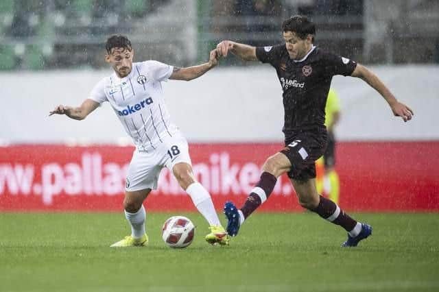 Donis Avdijaj battles Peter Haring during Zurich's win over Hearts. Pic: Ennio Leanza/Keystone via AP