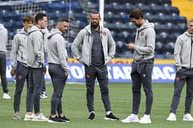 United assess the surface before the Premiership kick-off. (Photo by Rob Casey / SNS Group)