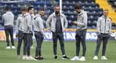 United assess the surface before the Premiership kick-off. (Photo by Rob Casey / SNS Group)