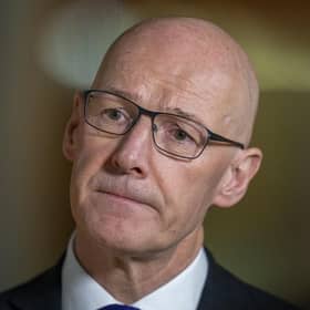 Deputy First Minister John Swinney speaks to the media after delivering a budget statement to the Scottish Parliament at Holyrood, Edinburgh.