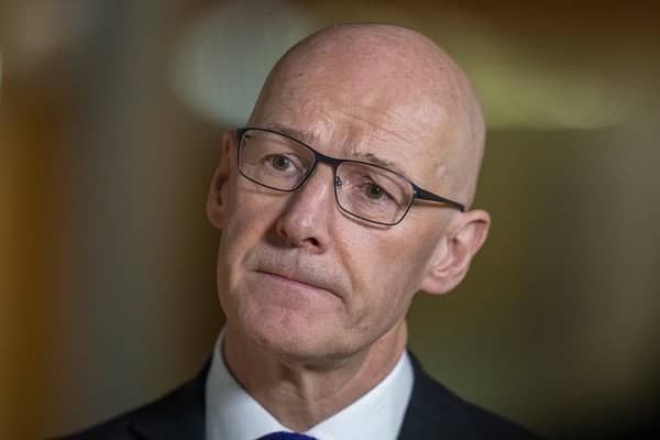 Deputy First Minister John Swinney speaks to the media after delivering a budget statement to the Scottish Parliament at Holyrood, Edinburgh.