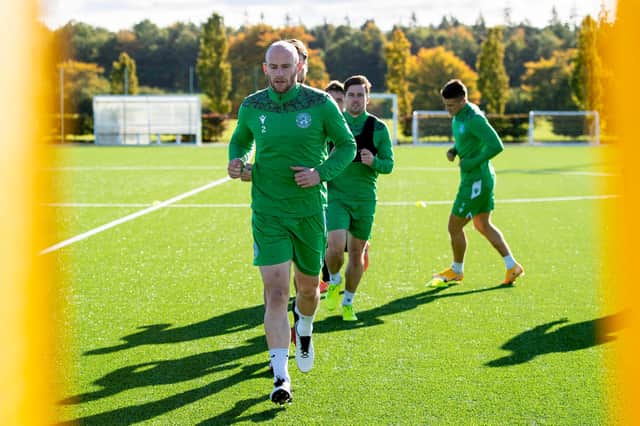 David Gray leads the way at training at East Mains. The Hibs captain says he feels as fit as he ever has and hasn't missed one training session