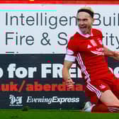 Ryan Hedges slides in celebration after scoring for Aberdeen against Celtic at Pittodrie last month. The Welsh international is hoping for more reasons to be cheerful at Ibrox on Sunday. (Photo by Craig Foy / SNS Group)