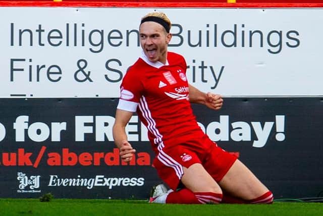 Ryan Hedges slides in celebration after scoring for Aberdeen against Celtic at Pittodrie last month. The Welsh international is hoping for more reasons to be cheerful at Ibrox on Sunday. (Photo by Craig Foy / SNS Group)