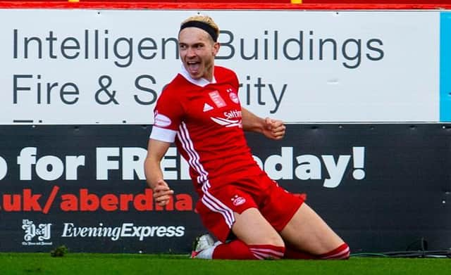 Ryan Hedges slides in celebration after scoring for Aberdeen against Celtic at Pittodrie last month. The Welsh international is hoping for more reasons to be cheerful at Ibrox on Sunday. (Photo by Craig Foy / SNS Group)