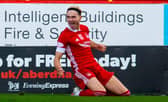 Ryan Hedges slides in celebration after scoring for Aberdeen against Celtic at Pittodrie last month. The Welsh international is hoping for more reasons to be cheerful at Ibrox on Sunday. (Photo by Craig Foy / SNS Group)