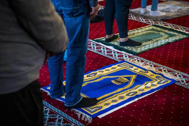 Muslims take part in morning prayers on Eid al-Adha at The Mevlana Mosque in Rotterdam in 2021, as they join others celebrating the Festival of Sacrifice across the world. Photo: Lex van LIESHOUT / ANP / AFP) / Netherlands OUT via Getty Images.