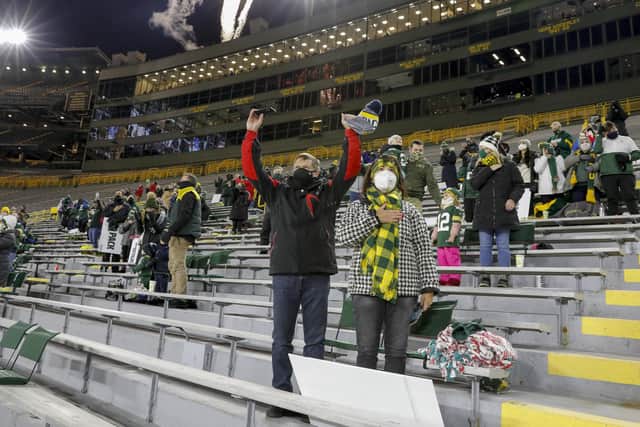 A limited number of socially distanced fans attend an American football game between the Green Bay Packers and the Chicago Bears on Sunday (Picture: Mike Roemer/AP)