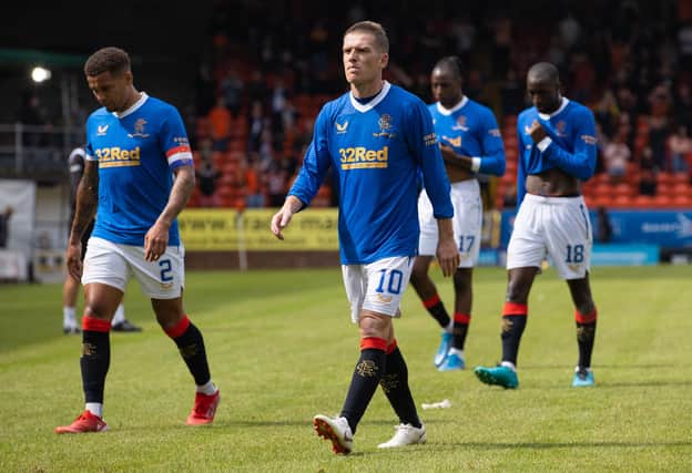 Dejected Rangers stars trudge off at full-time. Picture: SNS